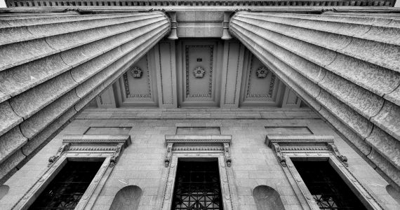 Black and white photo of government building columns
